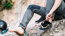 Man wearing boot before going for rock climbing