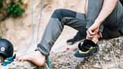 Man wearing boot before going for rock climbing